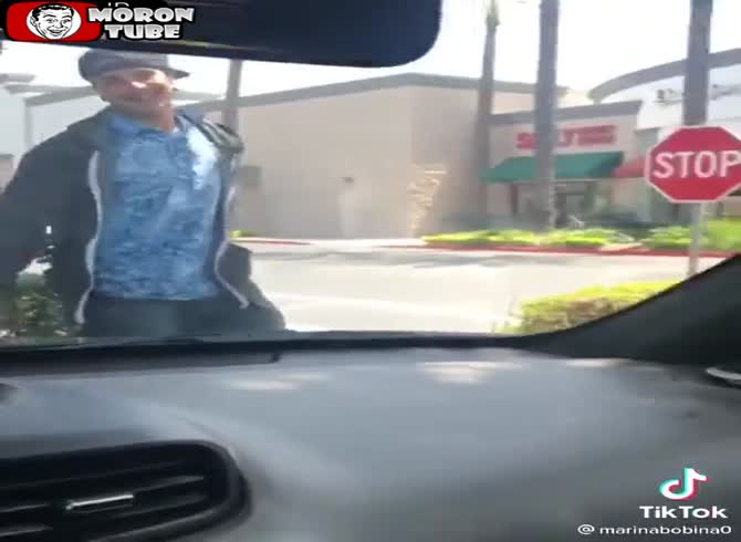 Video :A strange guy approaches her and she runs over his foot